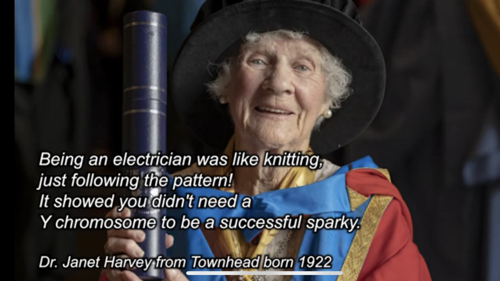 A person sit with text on screen in front of them