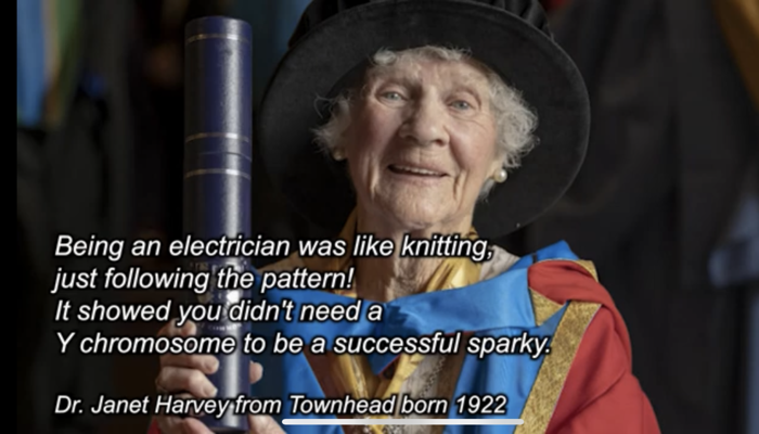 A person sit with text on screen in front of them