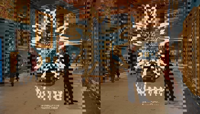 Inside The Burrell Collection in Glasgow with the Art Fund Museum of the Year logo in the middle of the image.