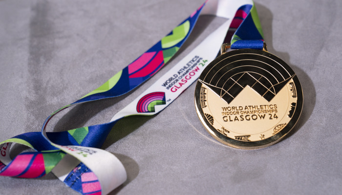 A gold medal with the inscription 'World Athletics Indoor Championships Glasgow 24'