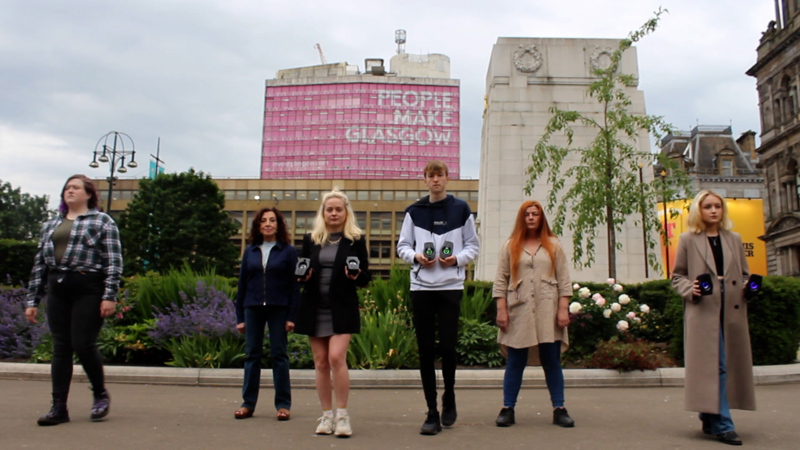 A group of young people standing in George Square