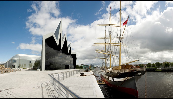 Photograph of a modern building against a blue sky