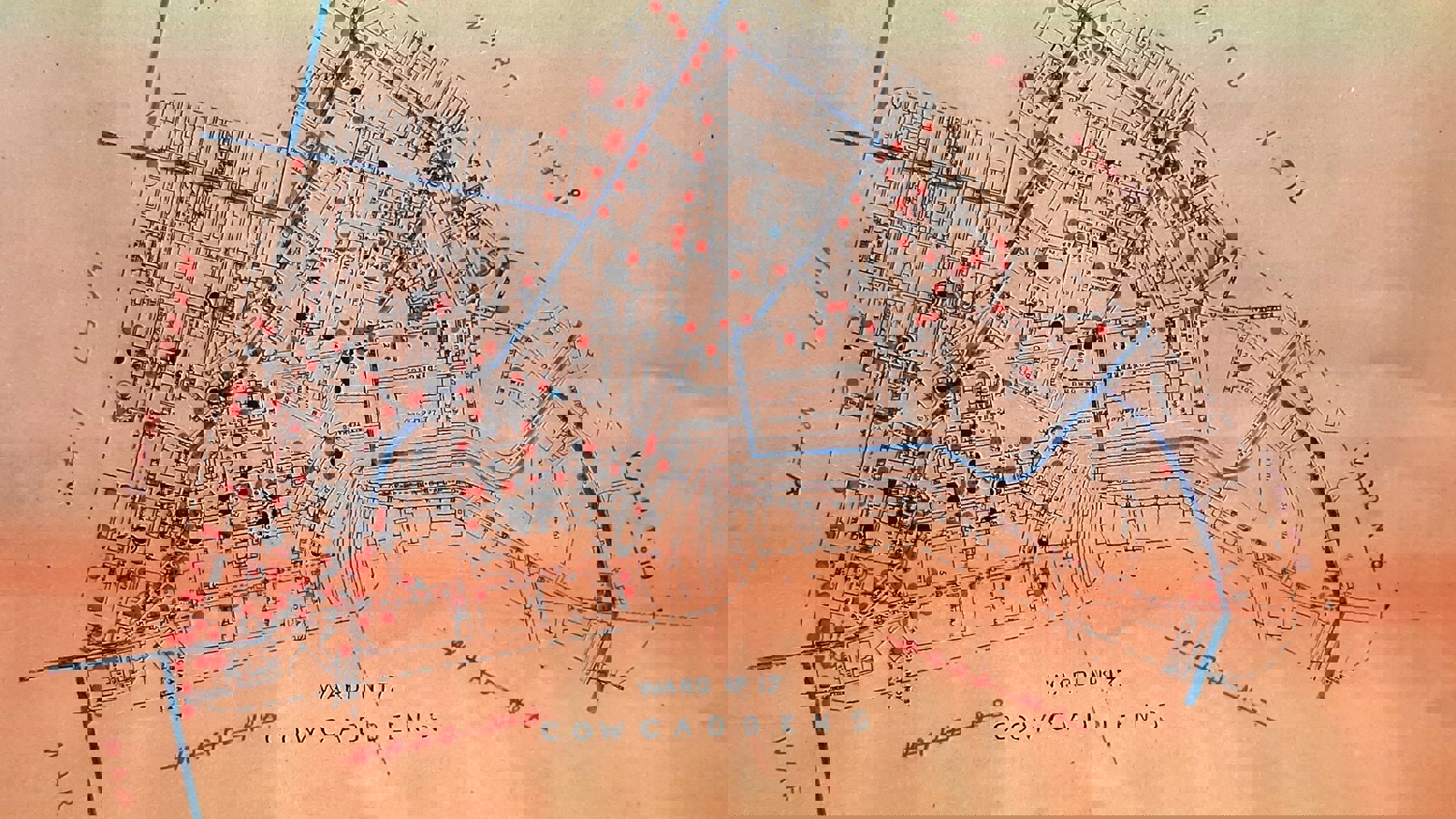 A map of pubs in Glasgow printed on an orange piece of paper and pub markers in red, black and blue.