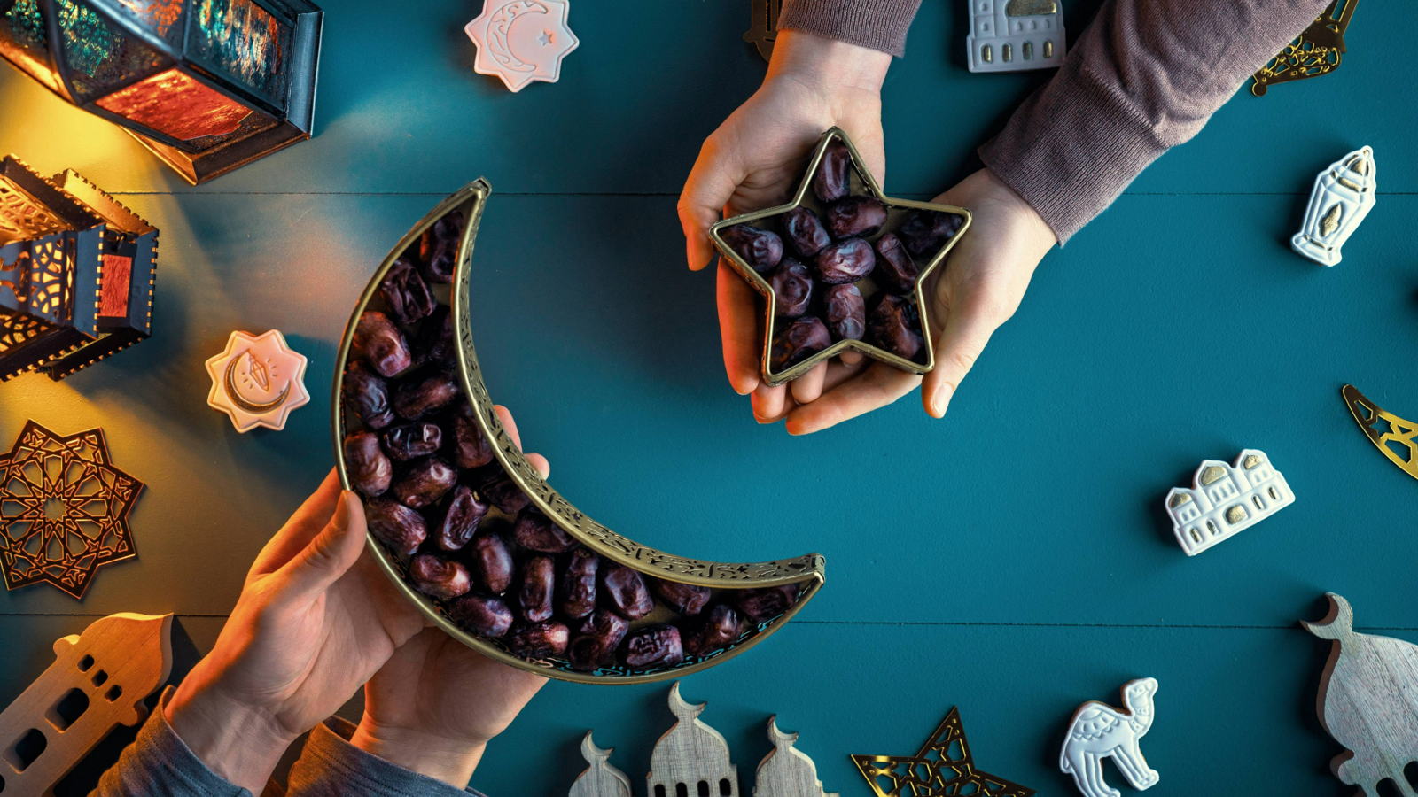 An image of dates being passed over during Ramadan