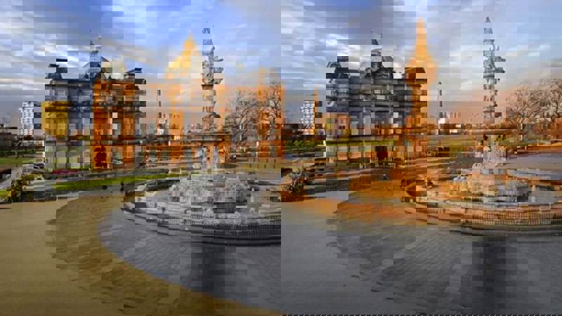 Peoples palace and fountain set against a blue winter sky