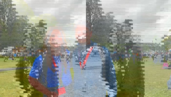 Megan and her partner Jake with their medals