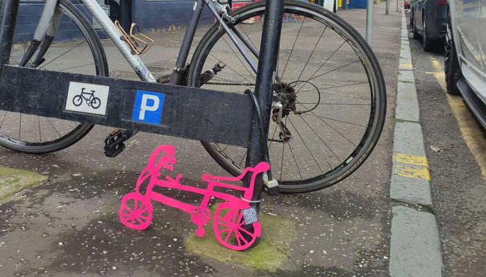 A photo of a bike in a busy street.